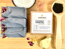 Load image into Gallery viewer, Scented Charcoal Soap Bar - Front Side of 120 g box with 3 120 g bars outside the box - charcoal powder and coconu tand shea butter