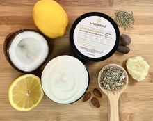 Load image into Gallery viewer,    ScentedLemongrassWhippedBodyButter_TopViewwithlemon_crackedcoconut_slicedhalflemon_rosemary_almonds_cocoapieces_lemongrass_chunkofsheabutter